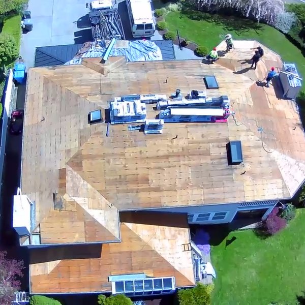 Corevia crew working on a stripped roof deck